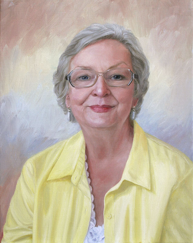 woman with gray hair and yellow blouse
