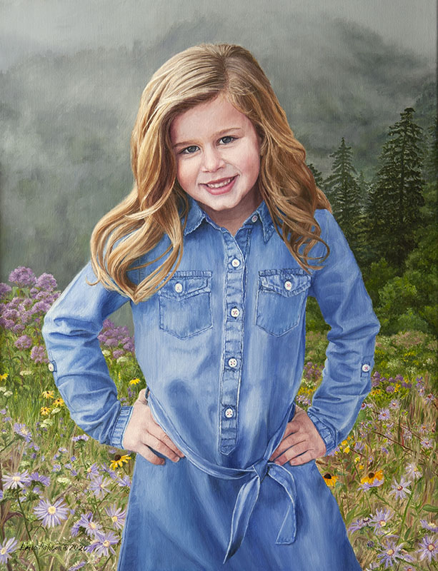 girl in blue jean dress with mountains