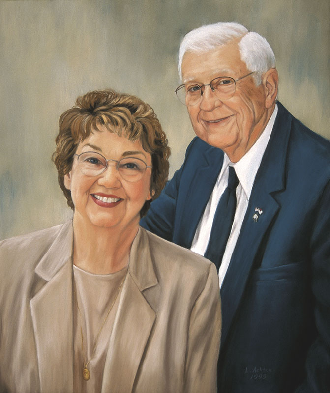 couple with tan dress and navy jacket