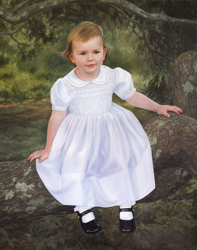 baby in white dress on a large limb