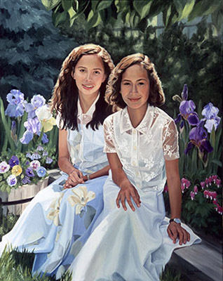 2 girls in white dresses in a garden