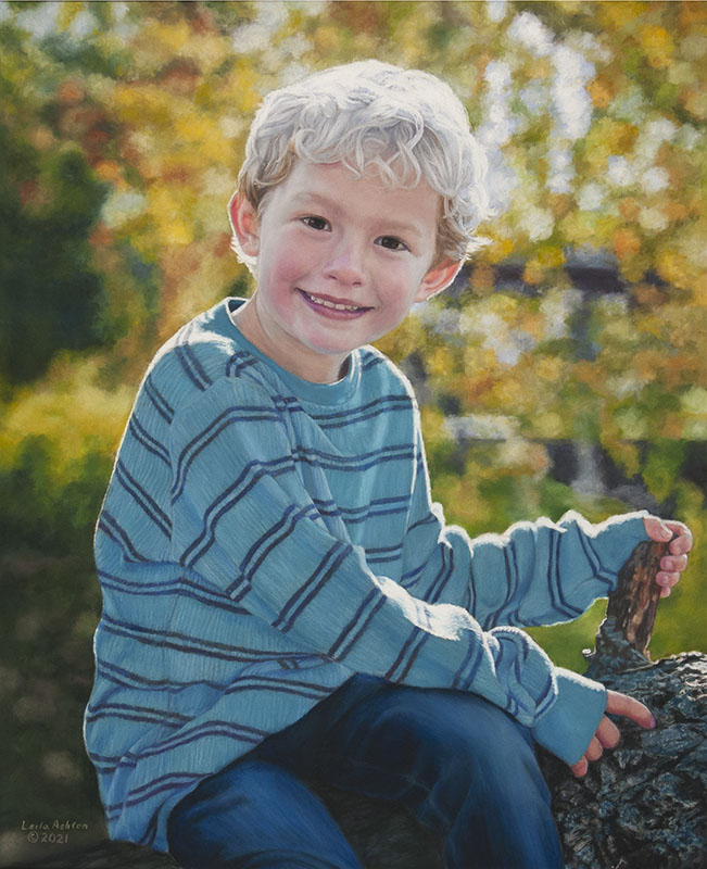 small blond boy in blue striped sweater