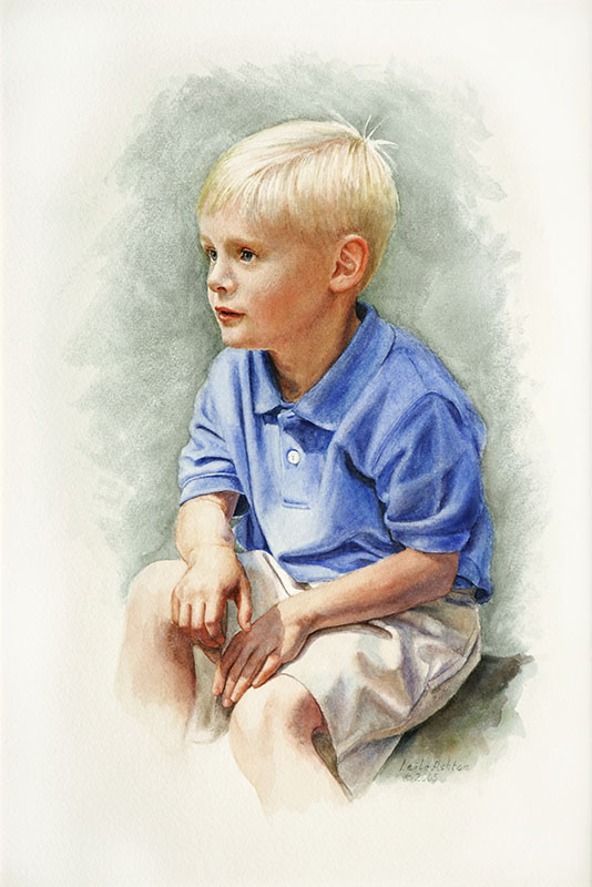 boy in blue shirt seated